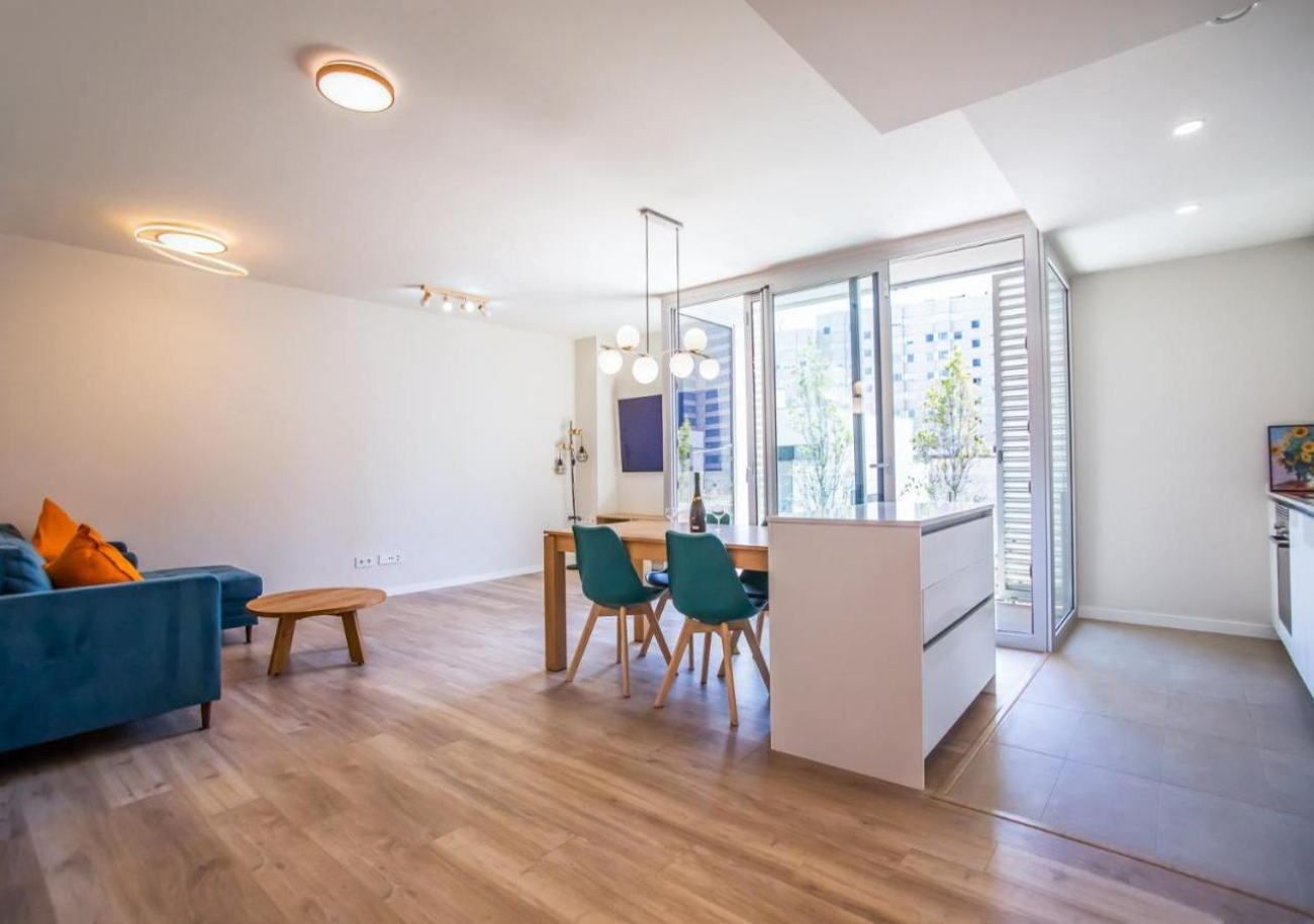Open-plan living room, dining area and kitchen at Forum Casa Barcelona